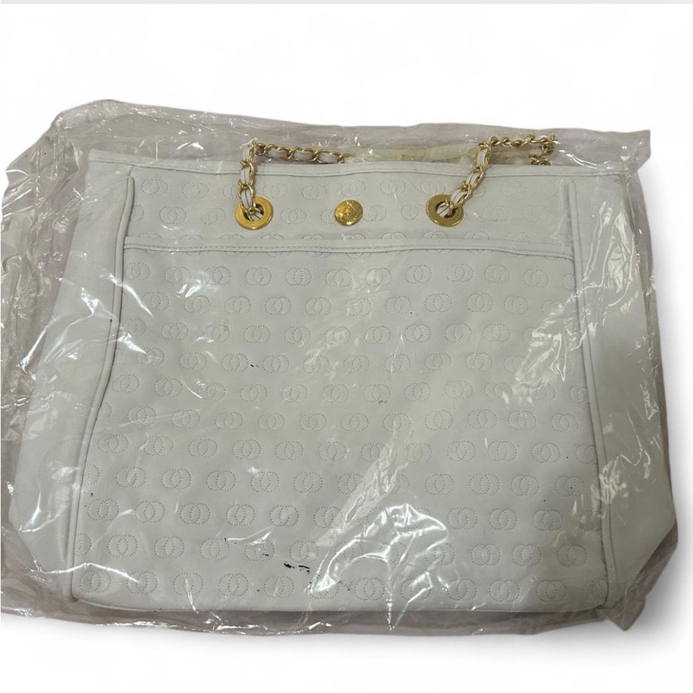 White Elizabeth Arden leather tote bag with golden hardware